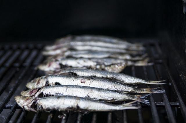 Trout smoking on a grill.