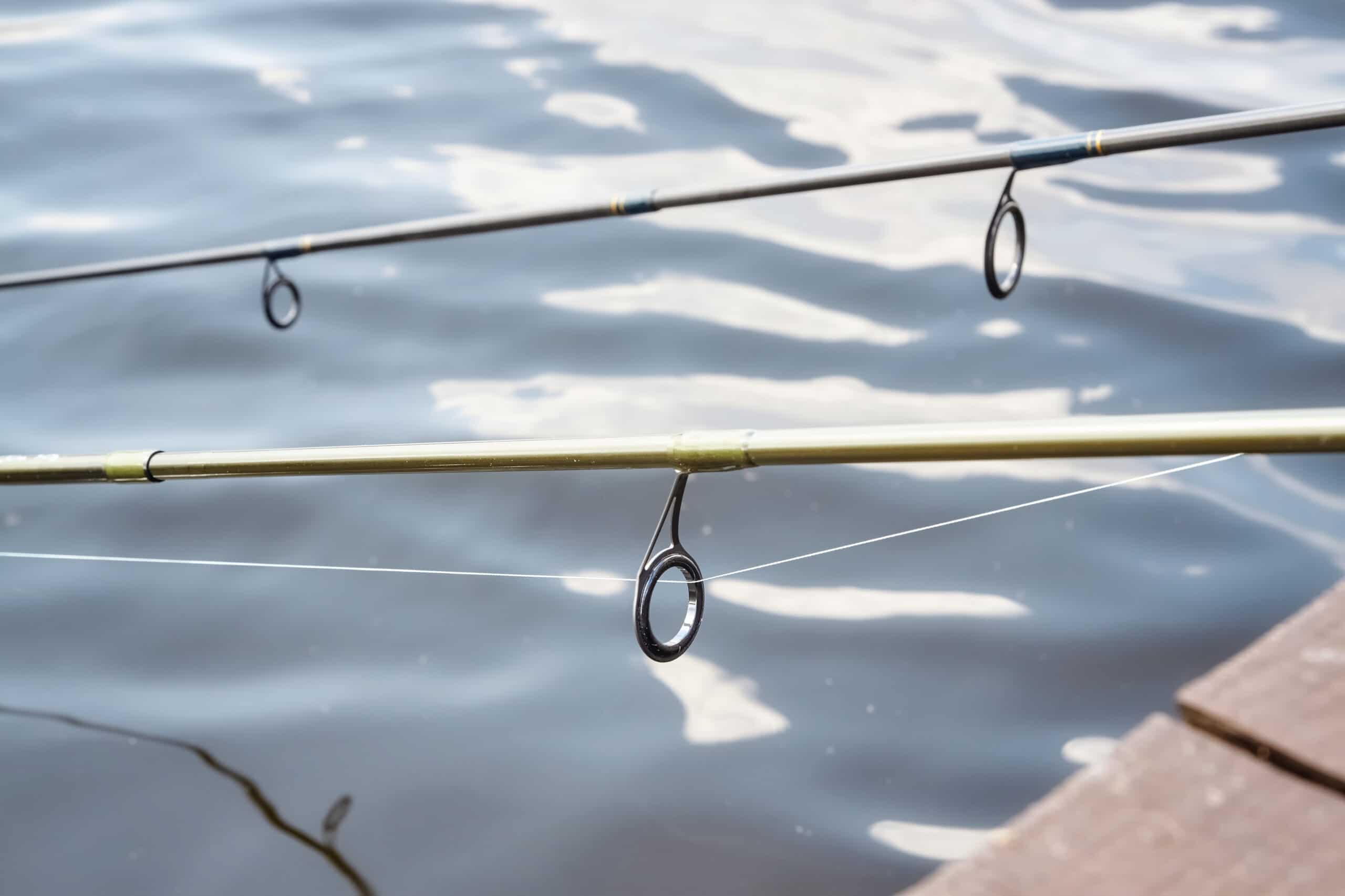 Close up picture of two fishing rods guides, shallow depth of field.