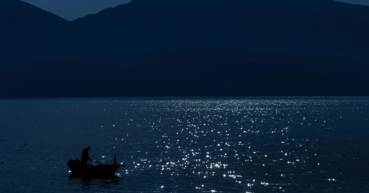 Boat on a lake at night
