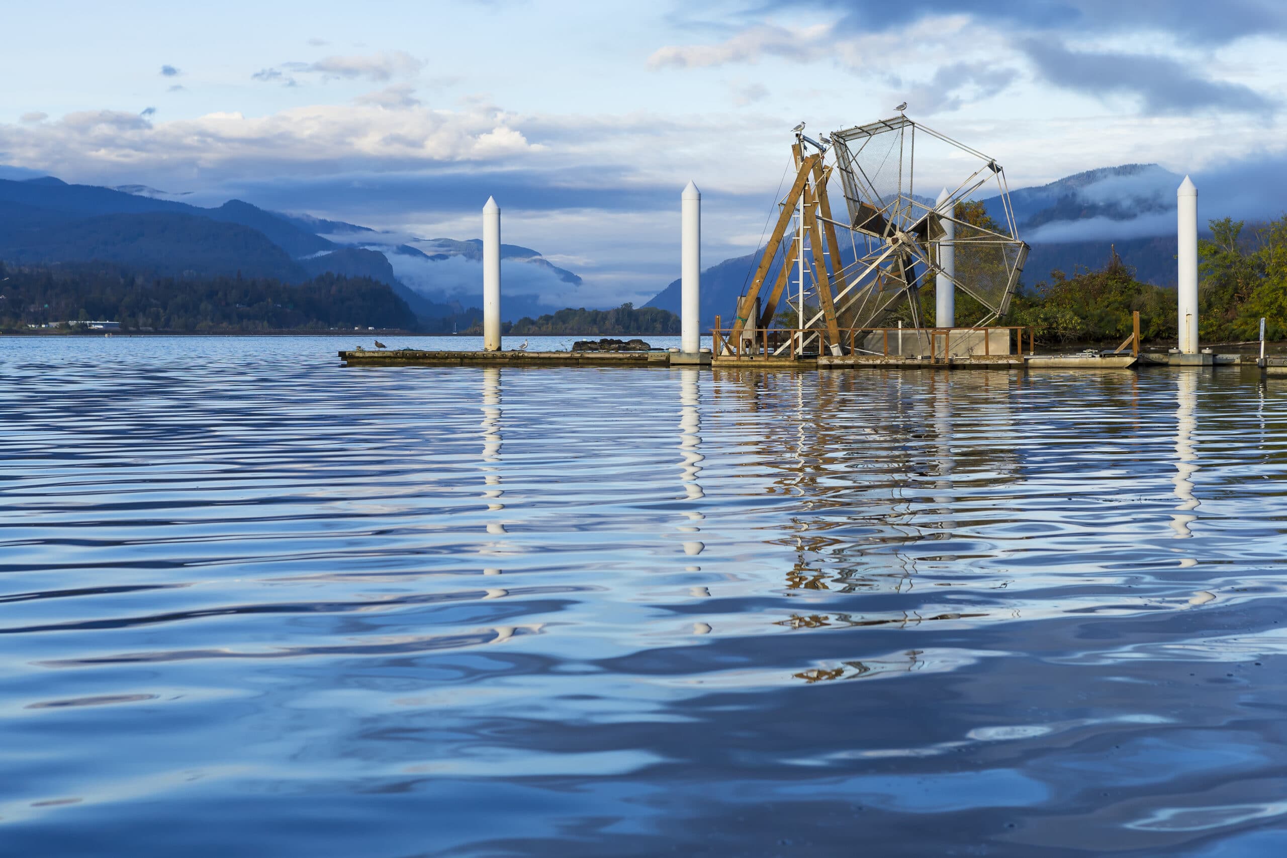 Fish Wheel on the Columbia River Gorge, Washington. A fish wheel is a device for catching fish that operates much as a water-powered mill wheel.