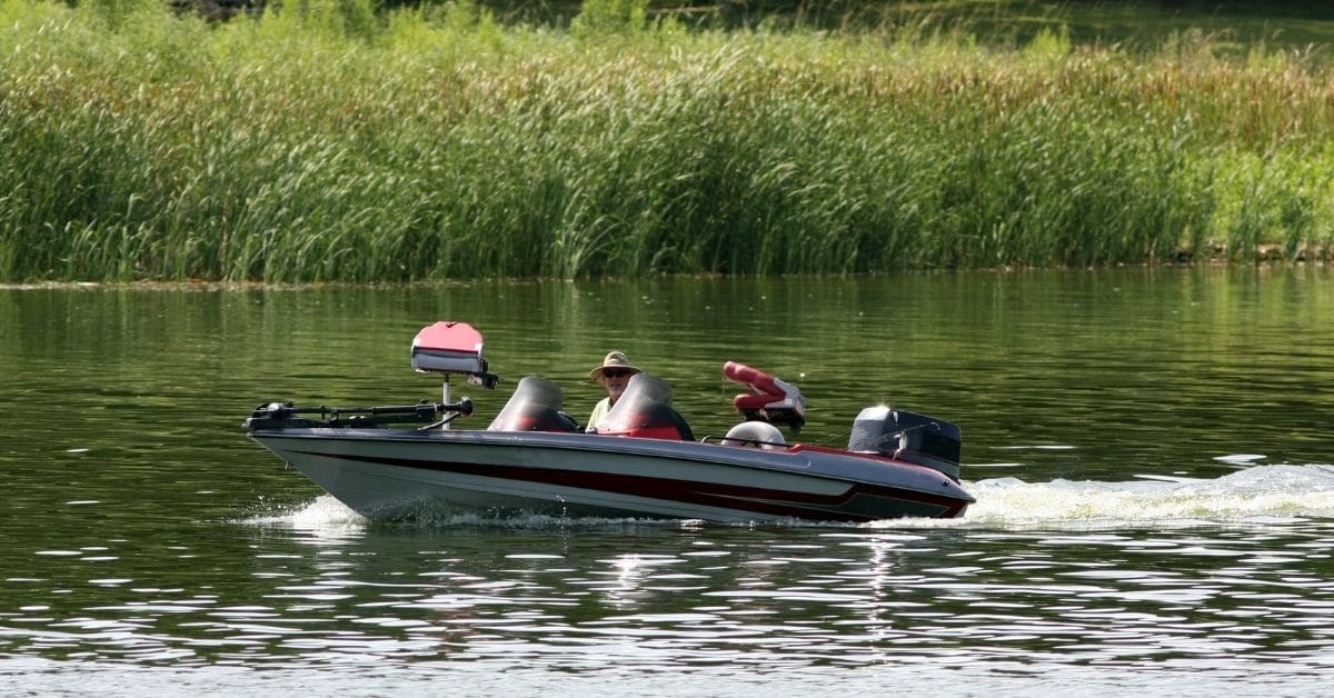 Man in a bass boat on a river